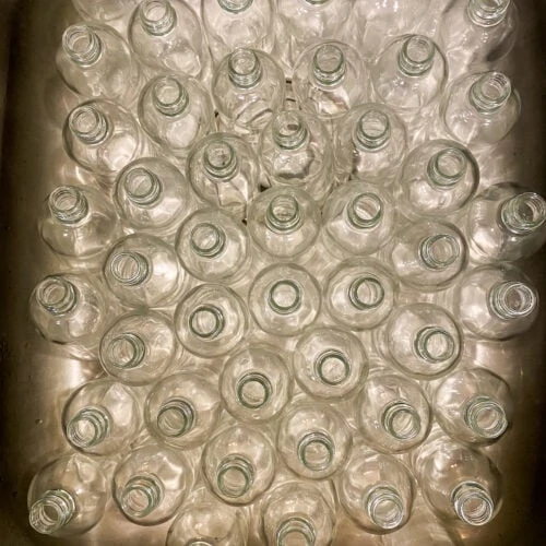 Empty advent bottles in the kitchen sink