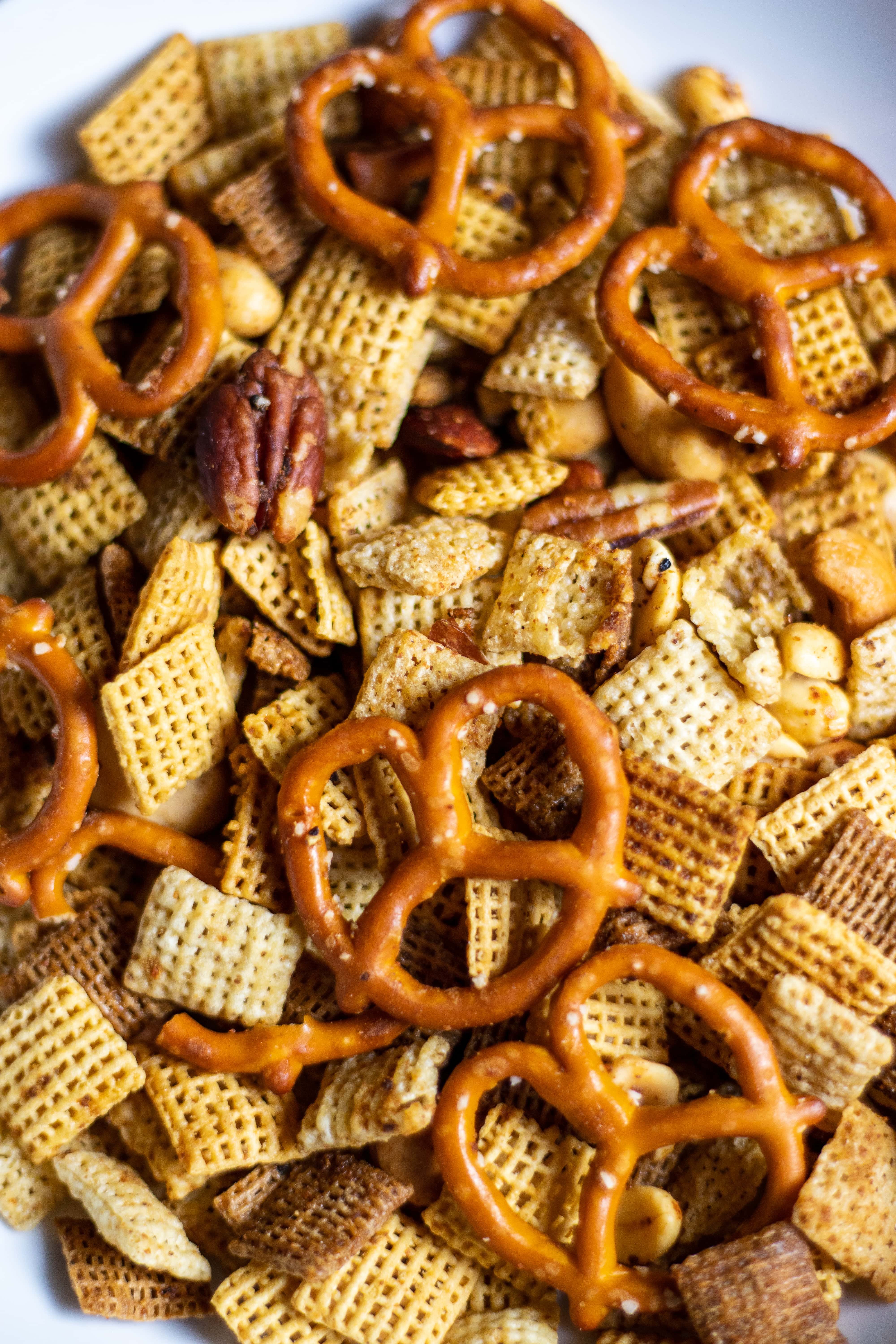 Close up of Chex mix with nuts and pretzels