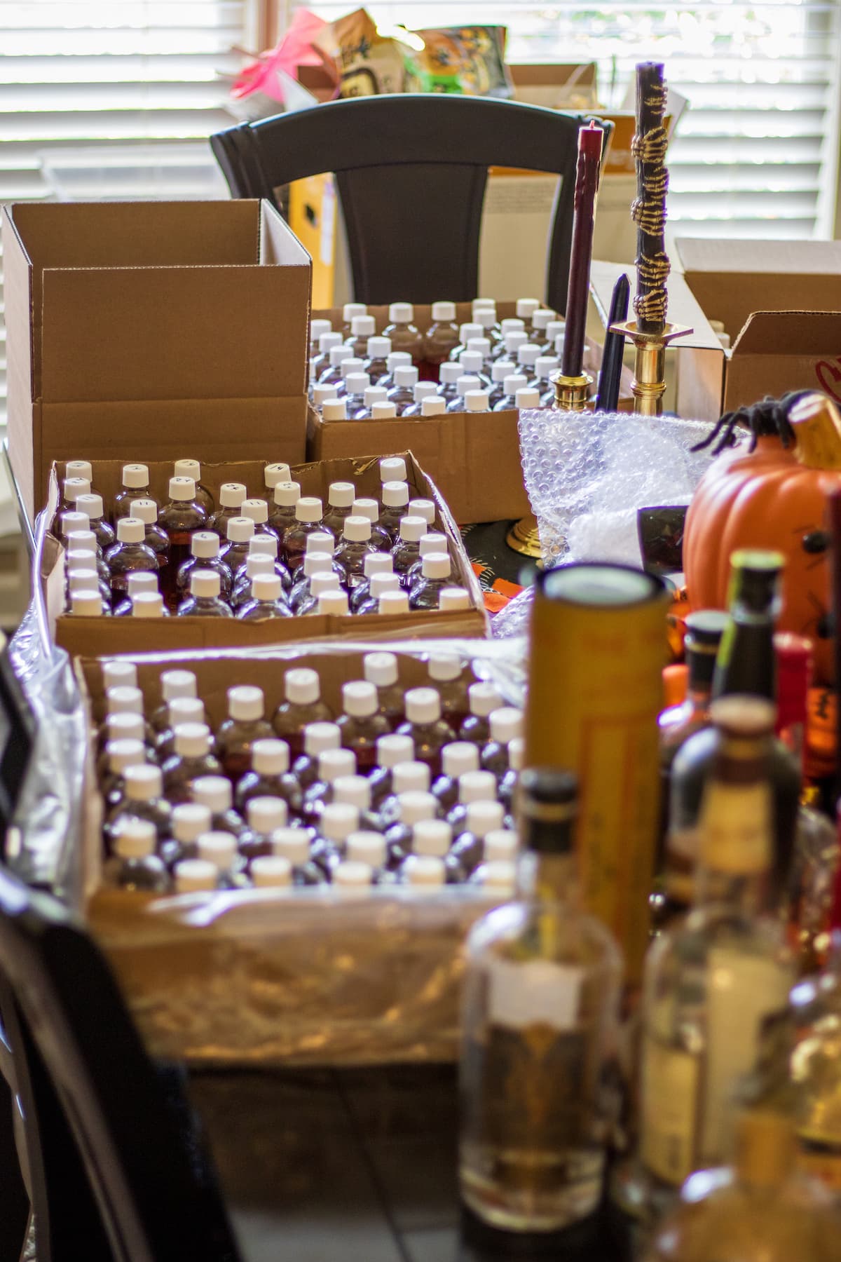 advent bottles on dining room table with empty whiskey bottles in the foreground