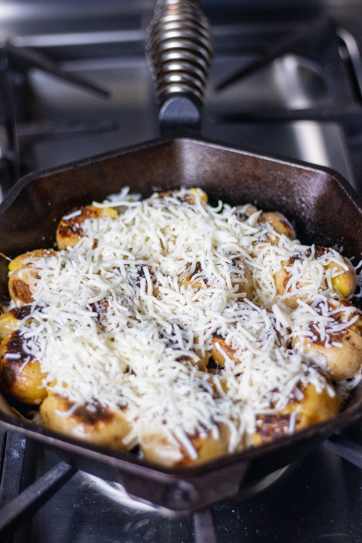 Cheese on potatoes in a skillet