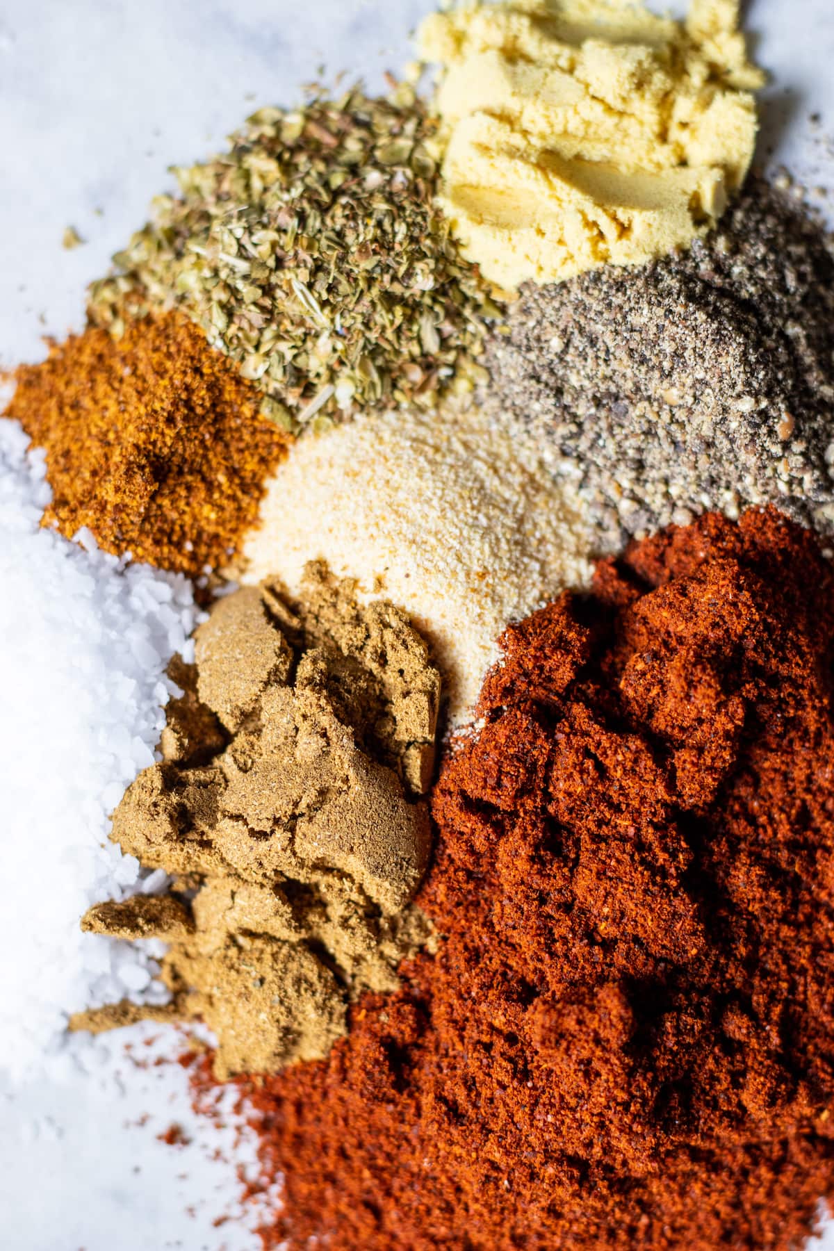 spices for the rub on a piece of parchment paper