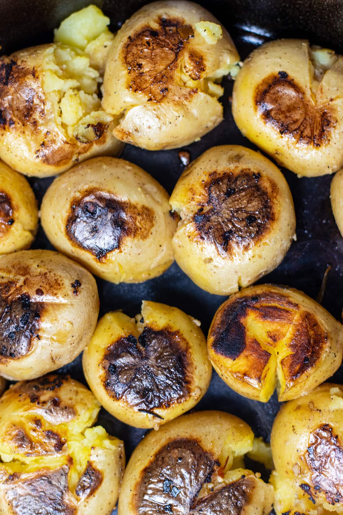 crisped skin on potatoes in a skillet. 